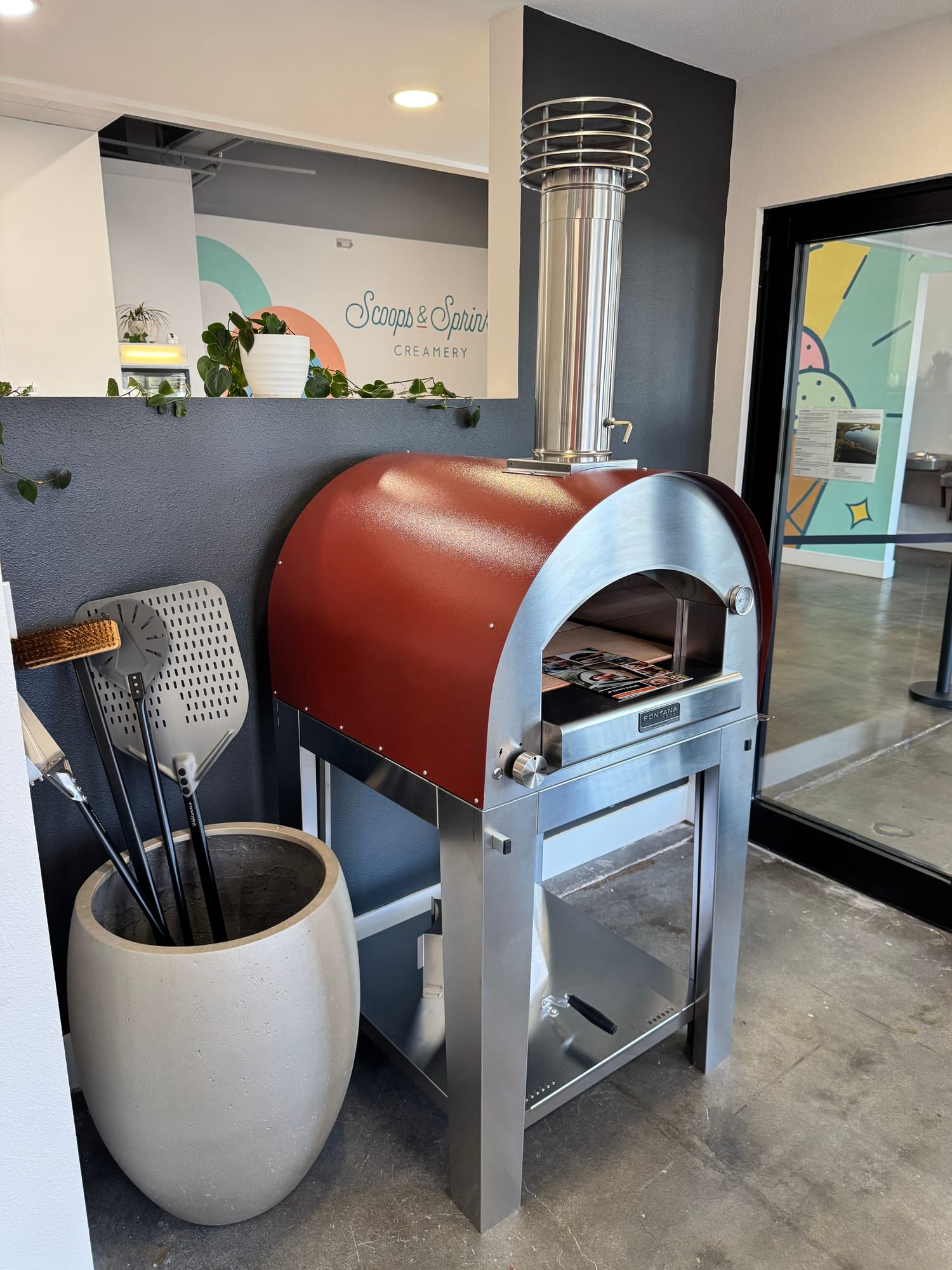 Fontana wood-fired pizza oven on a stainless stand.